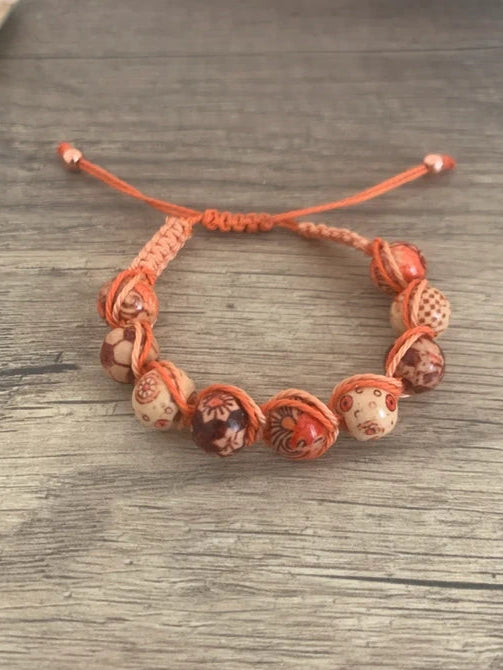 Bracelet Shambala ajustable en perles de bois orange corail