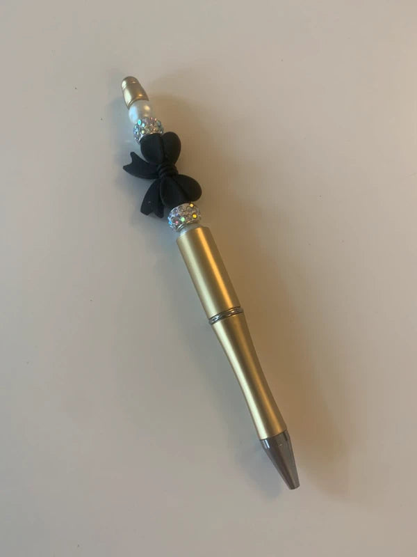 Stylo fantaisie doré gros noeud noir strass accessoire papeterie artisanal