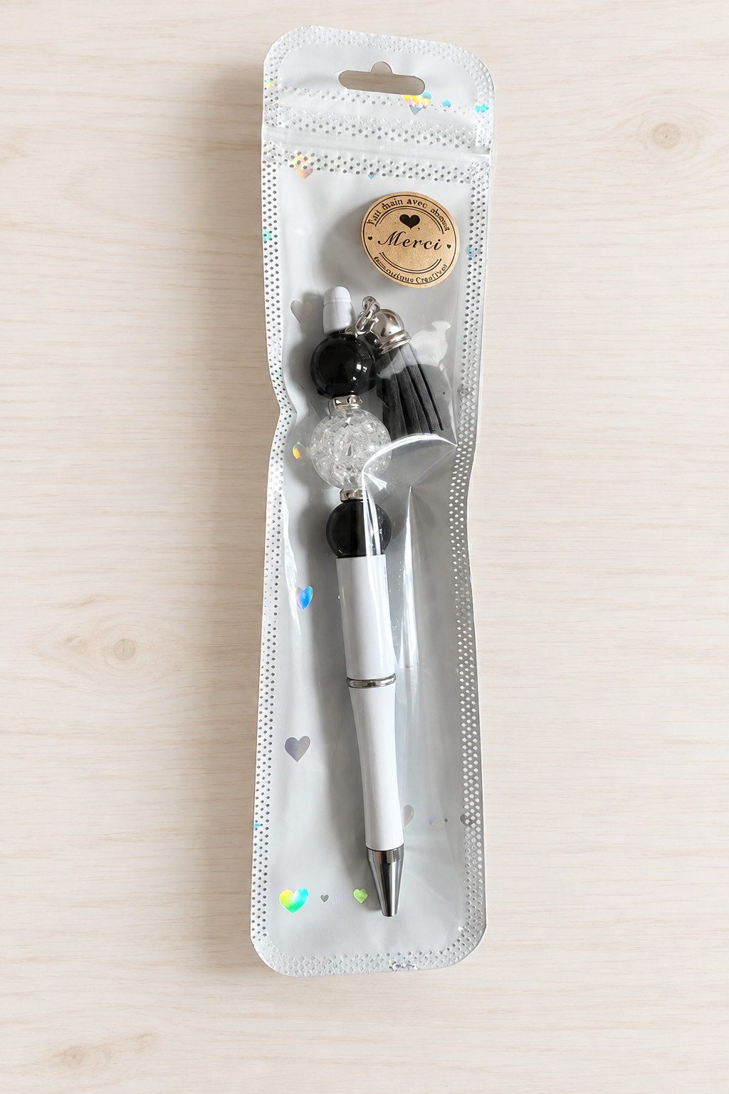 Stylo bubble-gum translucide noir et blanc à pompon