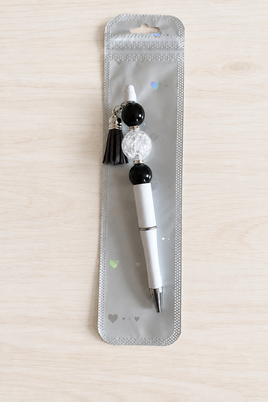 Stylo bubble-gum translucide noir et blanc à pompon