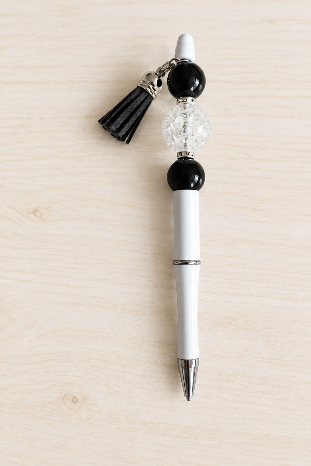 Stylo bubble-gum translucide noir et blanc à pompon