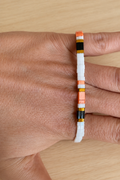 Bracelet fin élastique Half Tila blanc, noir et orange, grande taille