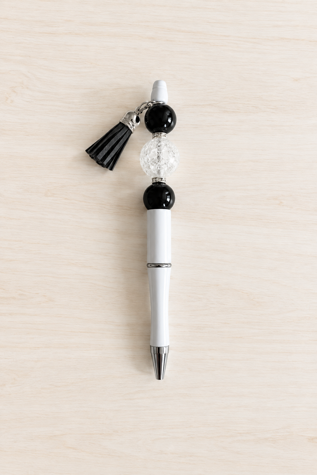 Stylo bubble-gum translucide noir et blanc à pompon
