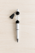 Stylo bubble-gum translucide noir et blanc à pompon
